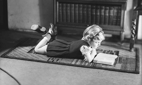 A young girl reading a book