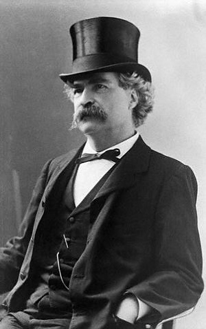 Original Caption: Mark Twain in tophat, ca. 1890.